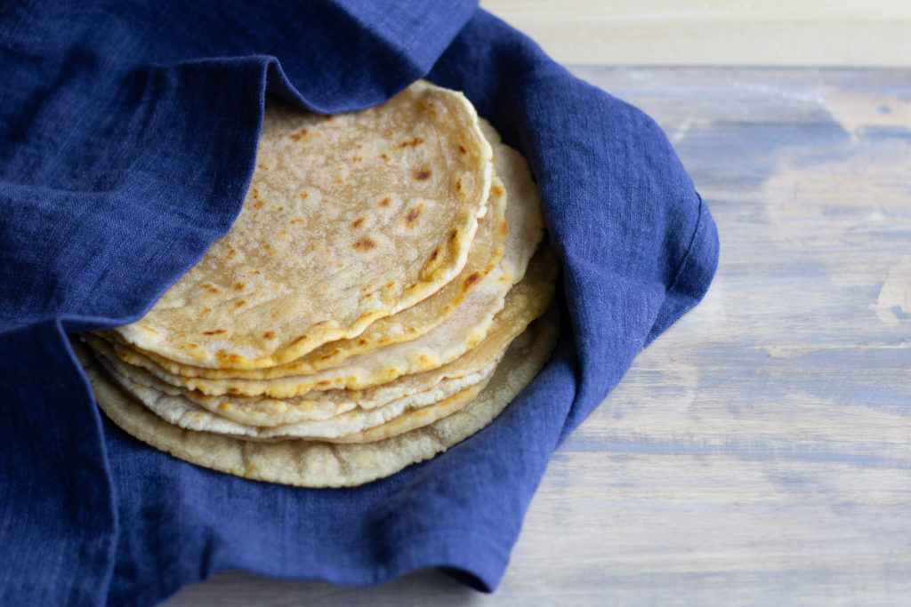 blue towel with a stack of flatbread