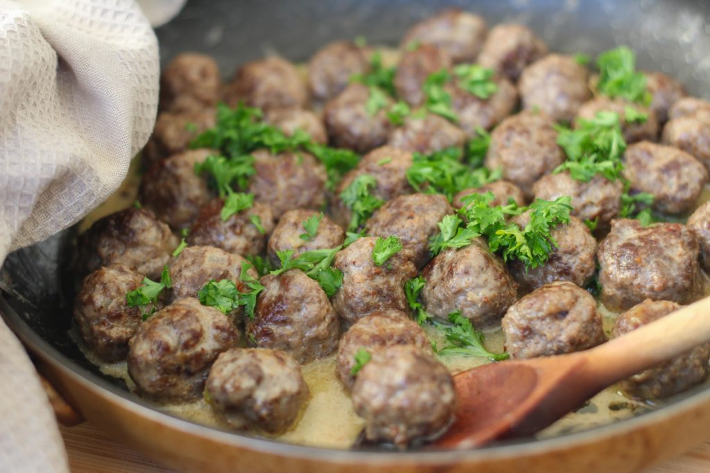 Skillet with meatballs in a cream sauce