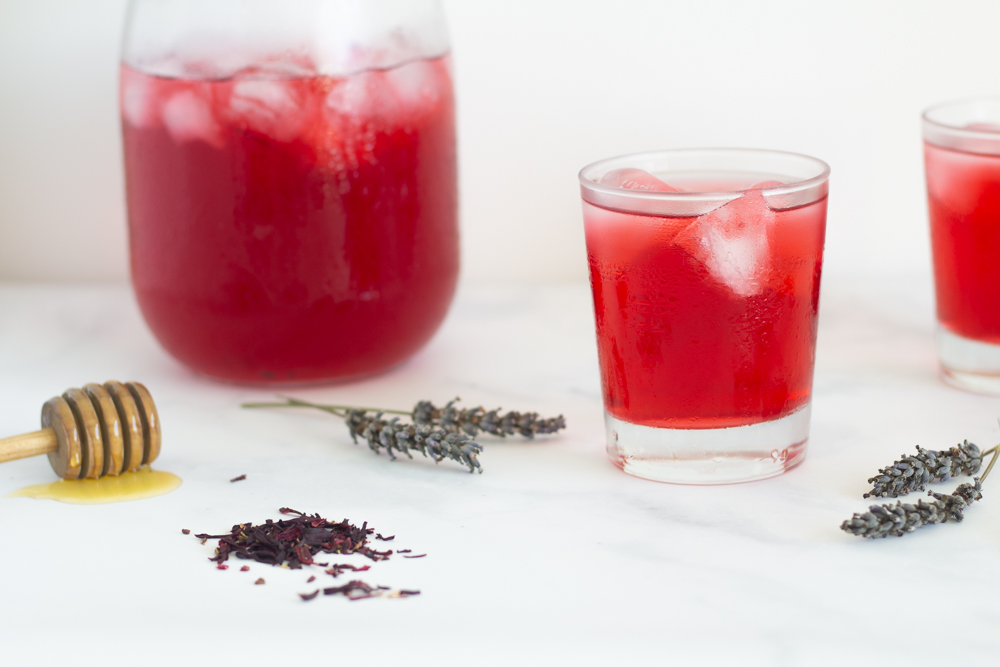 glasses and pitcher with ice cold hibiscus lavender iced tea