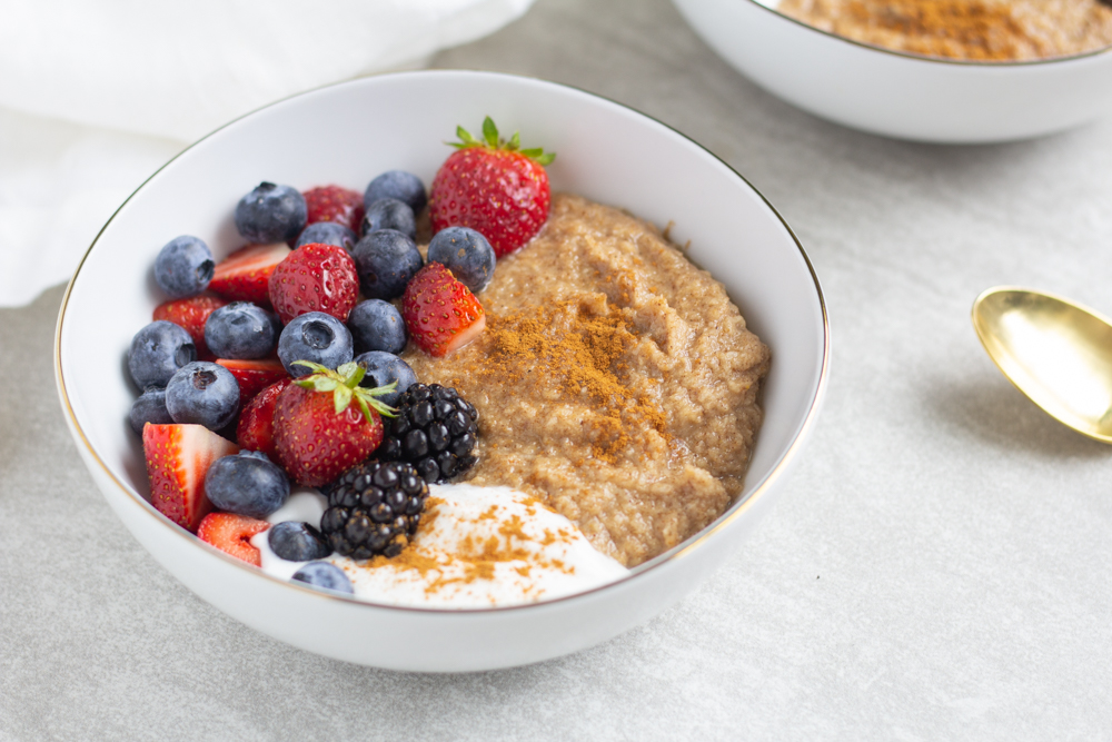 bowl with oatmeal, yogurt and berries