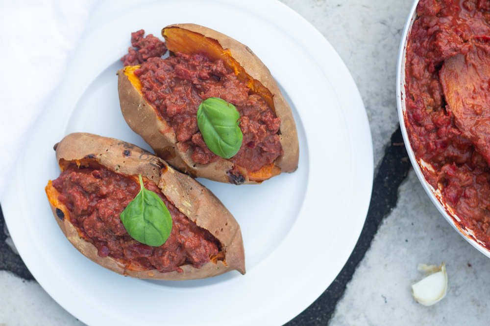 baked sweet potatoes stuffed with bolognese sauce