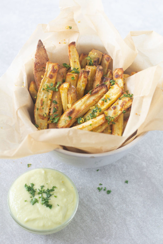 cheesy truffle fries in a bowl with aioli dip